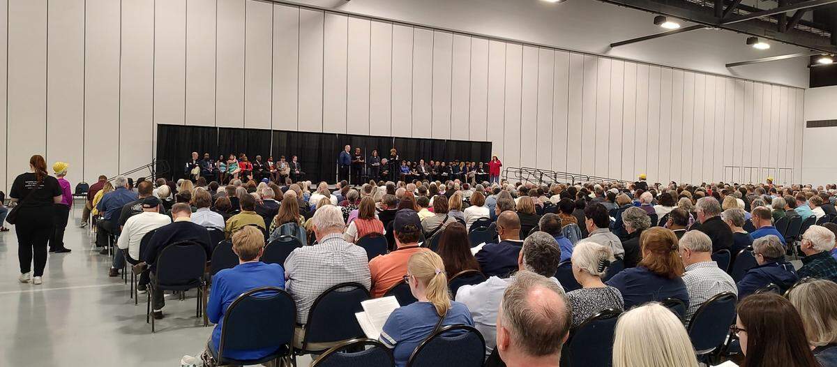 Members of BUILD, Building a United Interfaith Lexington through Direct Action, listened during the group’s Nehemiah Action Assembly Tuesday night as Charlie Lanter, Lexington’s Commissioner of Housing Advocacy and Community Development, took the stage.