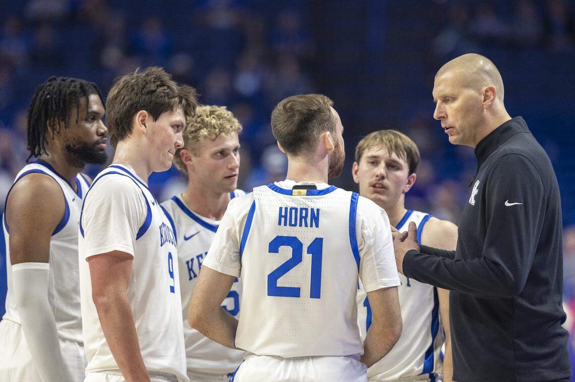 Kentucky head coach Mark Pope speaks with, from left to right, Ansley Almonor, Trent Noah, Collin Chandler, Walker Horn and Travis Perry during a timeout late in Wednesday’s game.