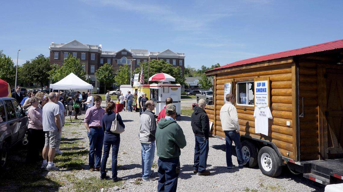Customers visited the food trucks at a Bluegrass Food Blast in April 2012. The event to promote mobile cuisine was held at an empty lot between Vine and Main streets.