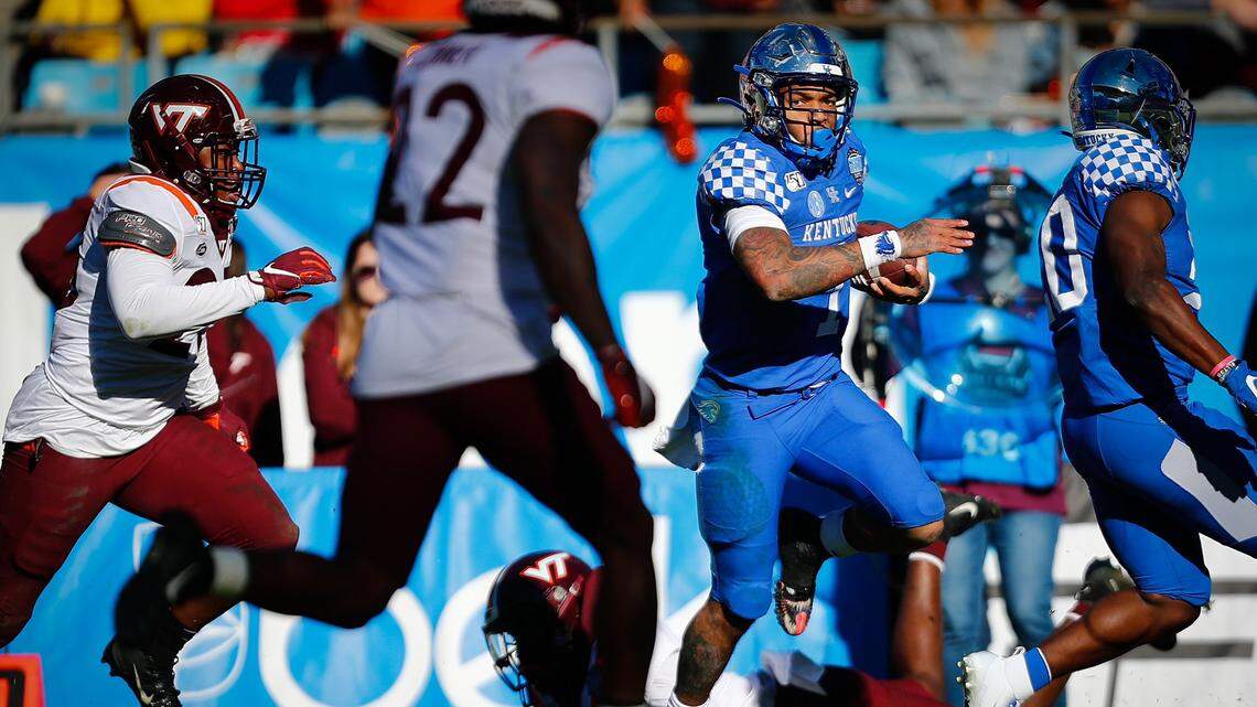 A Belk Bowl stunner: Kentucky’s record-setting rusher throws for the win