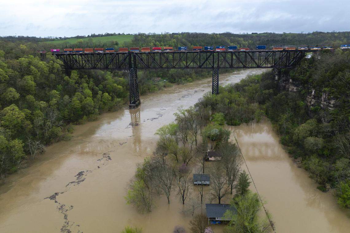 The Kentucky River surrounds homes on Dix Drive near High Bridge in Jessamine County on Saturday, April 5, 2025.
