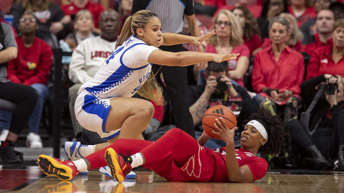 Kentucky forward Janae Walker (44) defends against Louisville guard Nina Rickards (15) during the second half Sunday in Louisville,