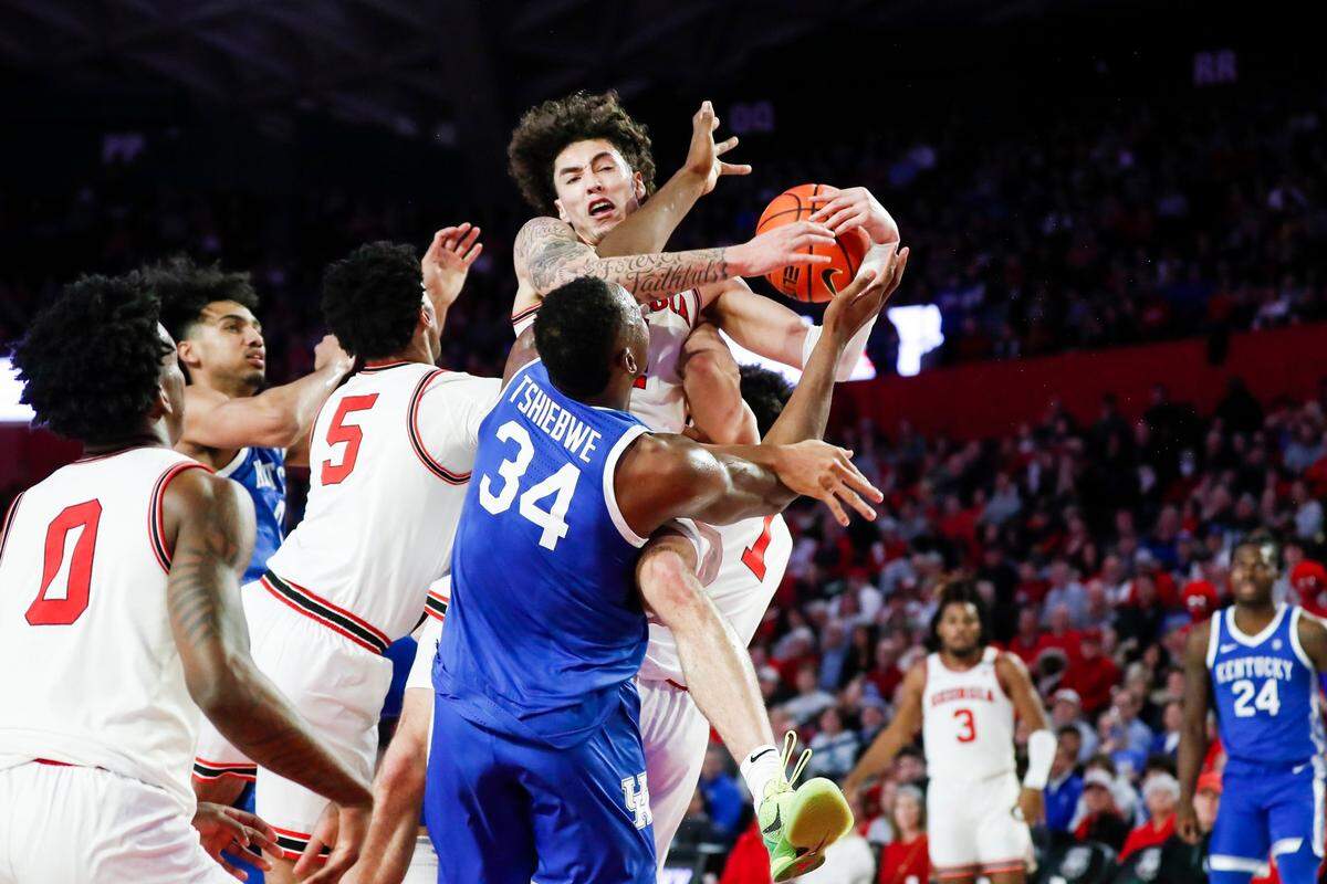 Kentucky’s Oscar Tshiebwe (34) tries to get a rebound against Georgia during Saturday’s game at Stegeman Coliseum in Athens, Ga.