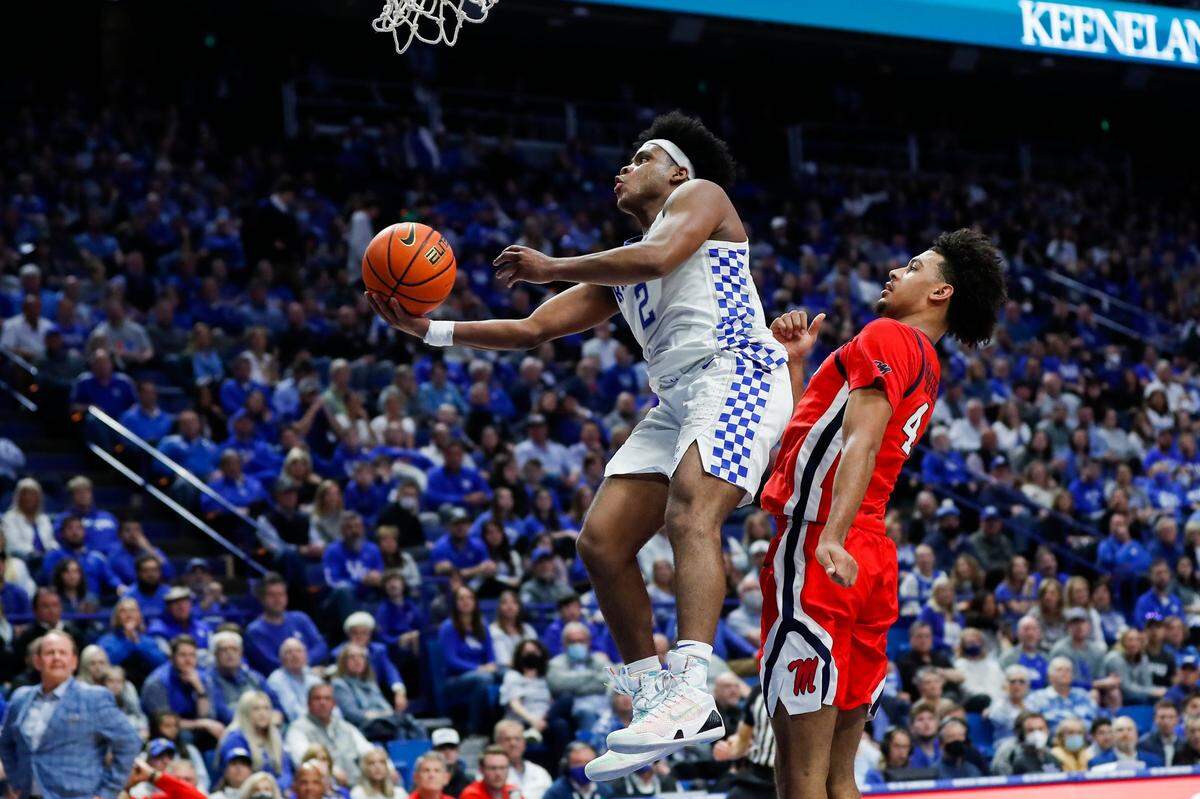 Kentucky point guard Sahvir Wheeler, left, drives to the basket against Mississippi forward Jaemyn Brakefield. Wheeler finished with 16 points and seven assists for the Cats.
