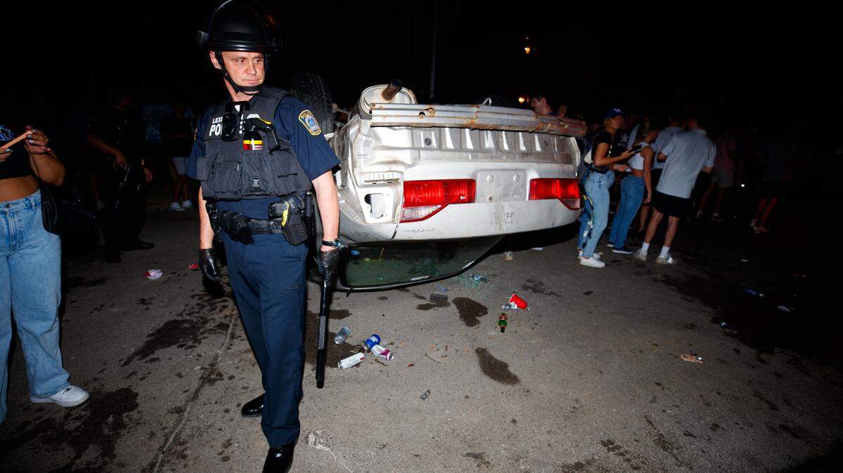 A vehicle was flipped on State Street Saturday night after the University of Kentucky Wildcats’ football win over the Florida Gators.