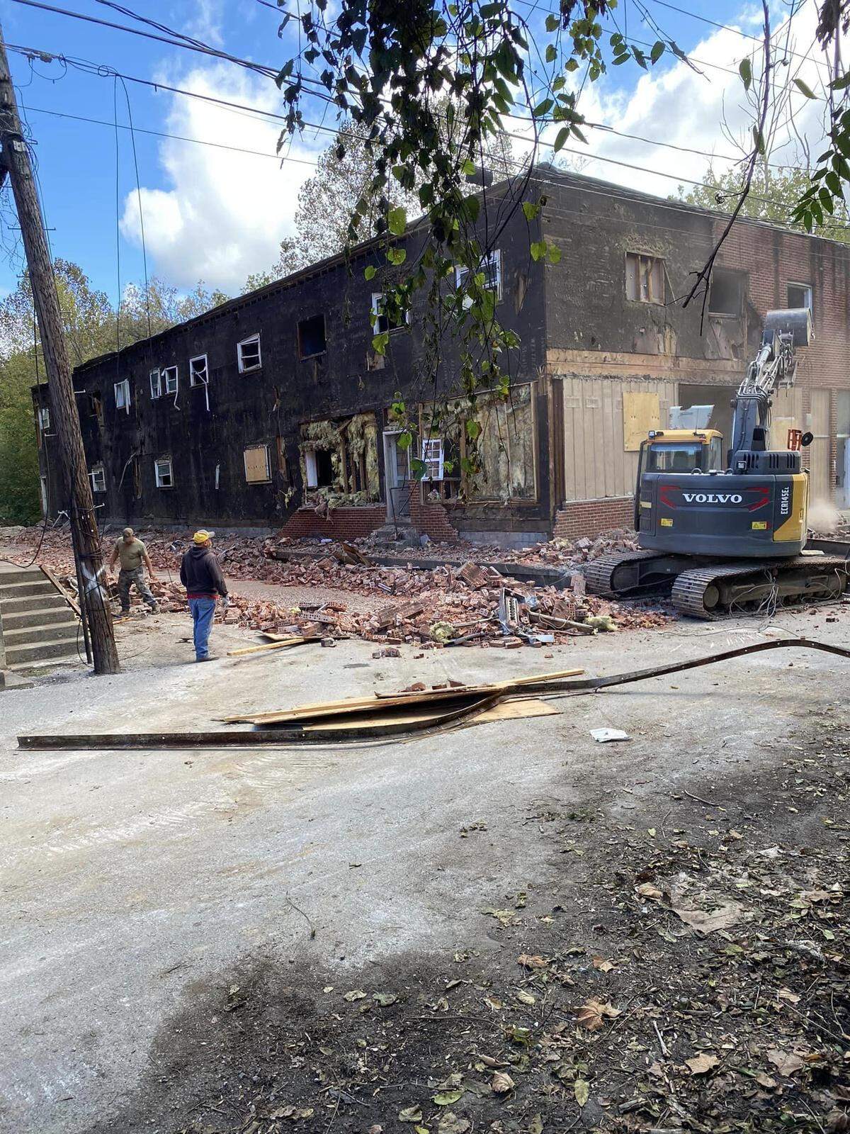 Workers used equipment to tear down a derelict building in downtown Manchester, Ky., as part of a redevelopment project.