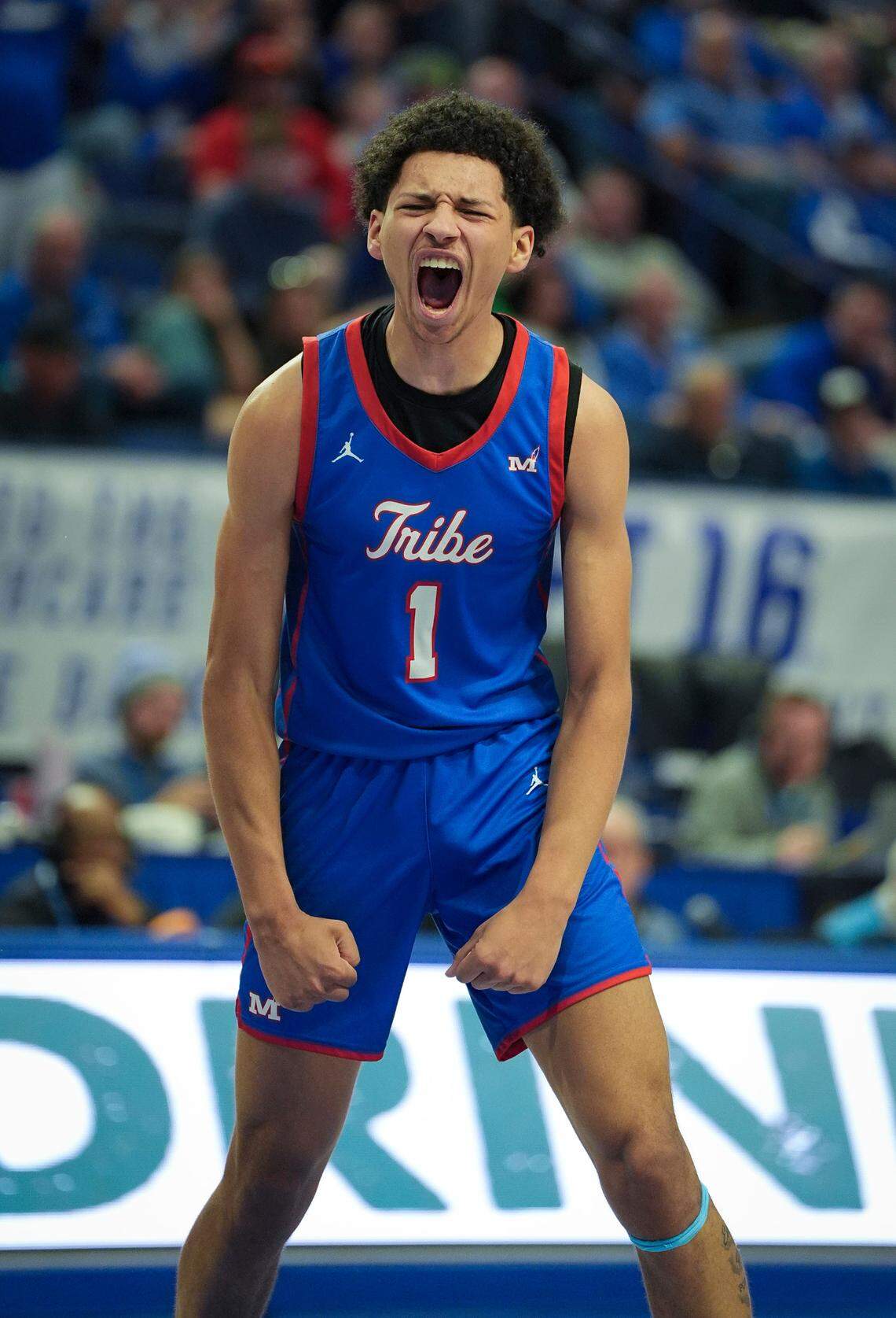 Montgomery County sophomore Tyce Jarvis shows excitement after dunking the ball during the UK Healthcare Boys’ Basketball Sweet 16 tournament game against North Laurel at Rupp Arena on March 28.