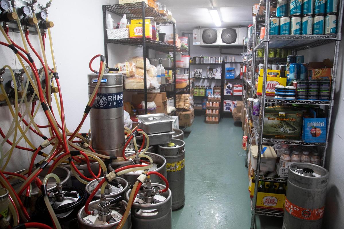 One of the storage containers that makes up the building structure of Hop’s Beer Garden and Restaurant has been converted to a cooler keeping drinks and food fresh.