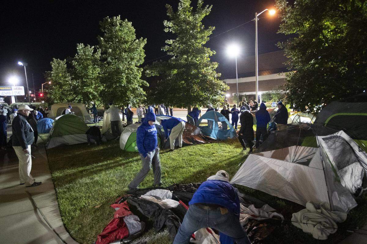 Fans rush to set up tents outside Memorial Coliseum for the Big Blue Madness campout in 2022.