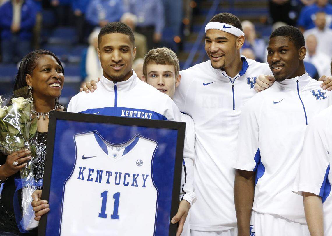 Twany Beckham holds his 2013 Senior Day jersey as teammates, left to right, Jarrod Polson, Willie Cauley-Stein and Alex Poythress look on. Beckham will be the GM of the La Familia team this summer, and Cauley-Stein will play for the squad.