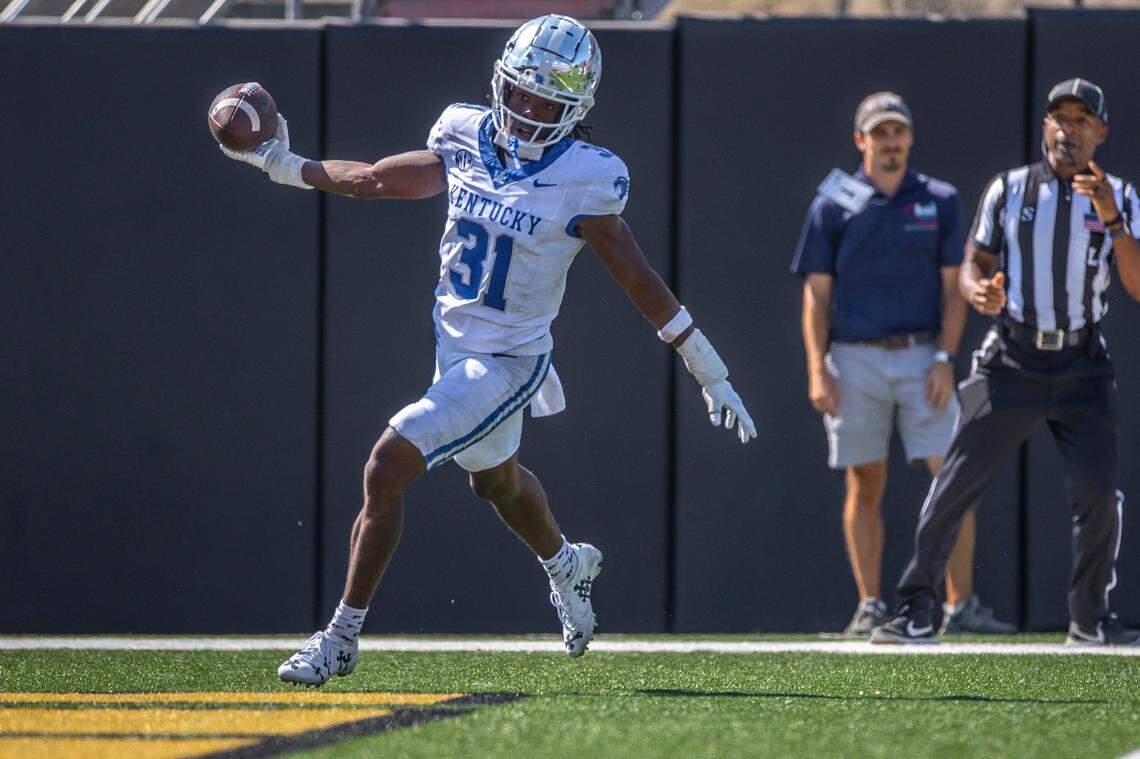 Kentucky cornerback Maxwell Hairston (31) celebrated after returning an interception for a touchdown in UK’s 45-28 win at Vanderbilt last season.