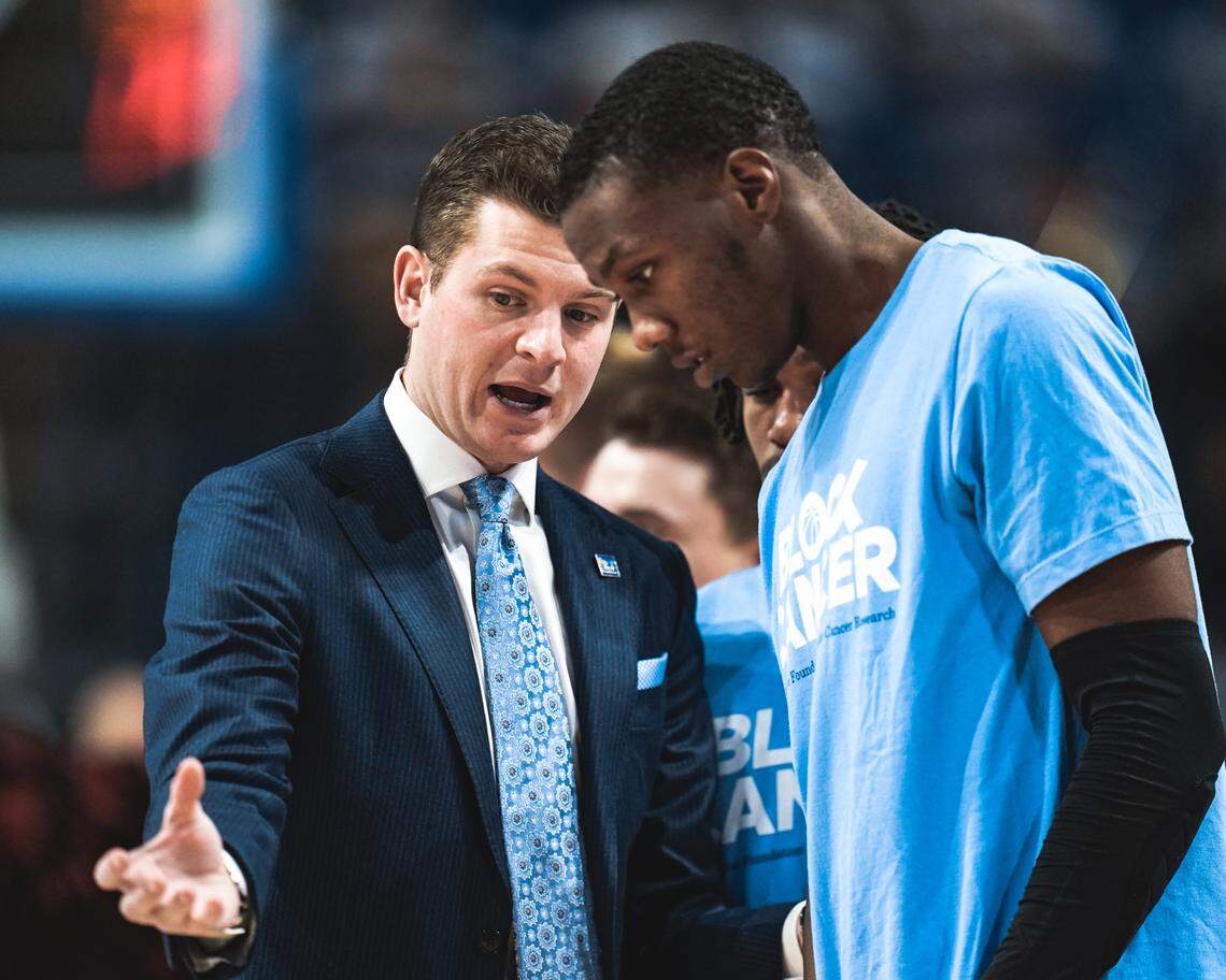 Saint Louis assistant Ford Stuen, left, instructed a player during a game against VCU. A Henderson County product and the nephew of Billikens head coach Travis Ford, Stuen, 29, died May 11 after contracting a mysterious illness. “(Stuen) was on the way to being a superstar in this business, a superstar coach,” Ford says.