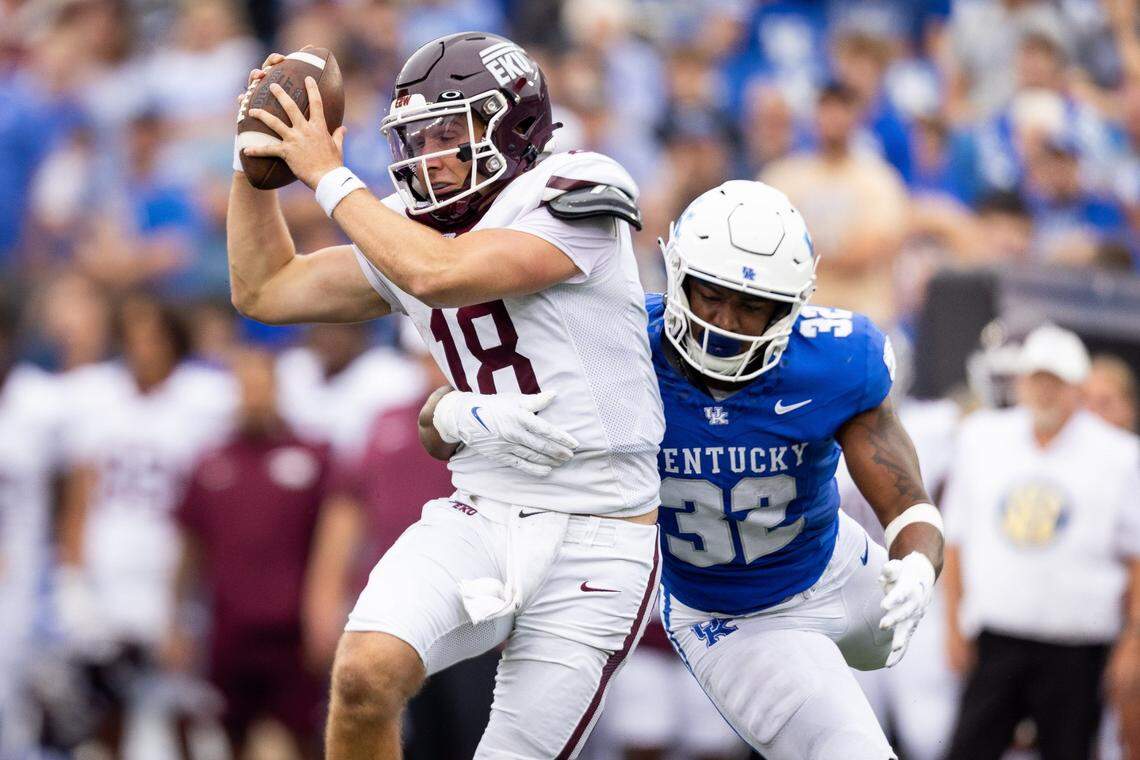 Kentucky weakside linebacker Trevin Wallace (32) sacks Eastern Kentucky quarterback Parker McKinney (18) during UK’s 28-17 win Saturday.