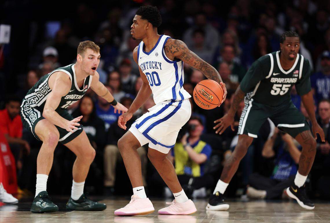 NEW YORK, NEW YORK - NOVEMBER 18: Otega Oweh #00 of the Kentucky Wildcats dribbles against Carson Cooper #15 of the Michigan State Spartans during the first half in the 2025 State Farm Champions Classic at Madison Square Garden on November 18, 2025 in New York City. (Photo by Ishika Samant/Getty Images)