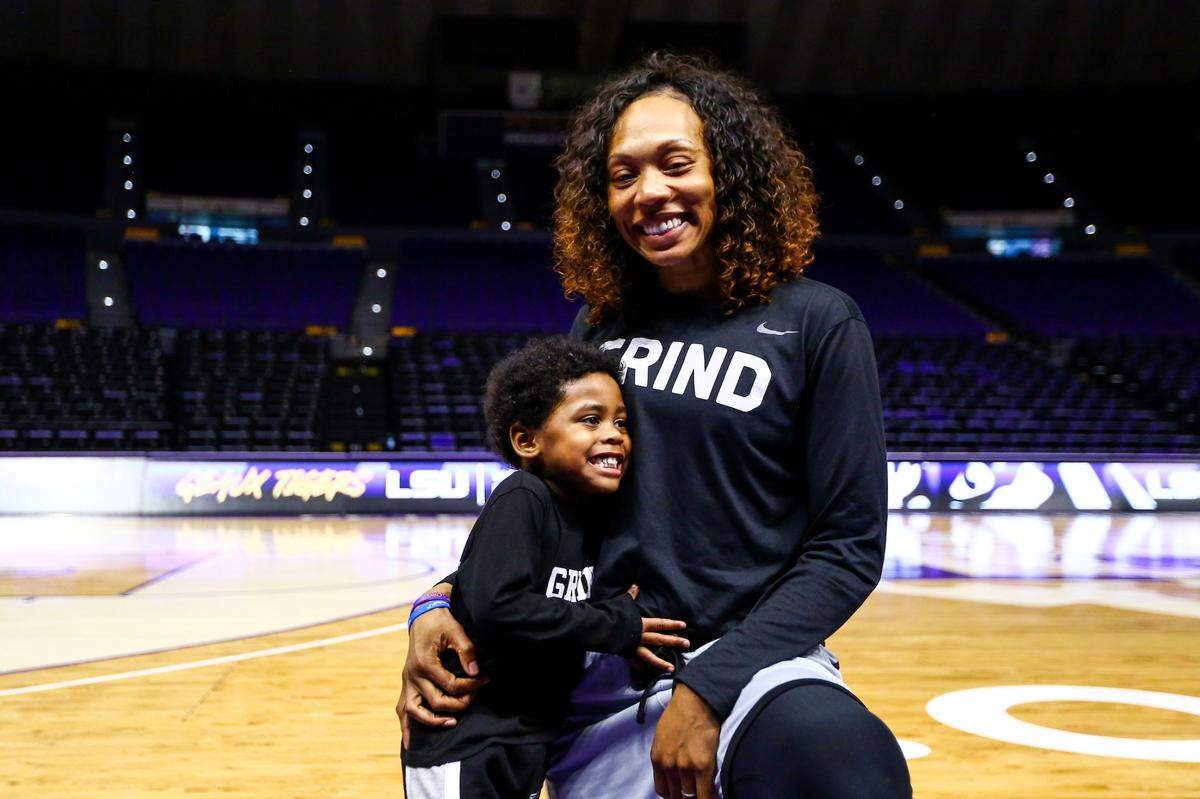 University of Kentucky women’s basketball coach Kyra Elzy pictured with her son, Jackson, before the Wildcats’ game at LSU on Jan. 19, 2020.