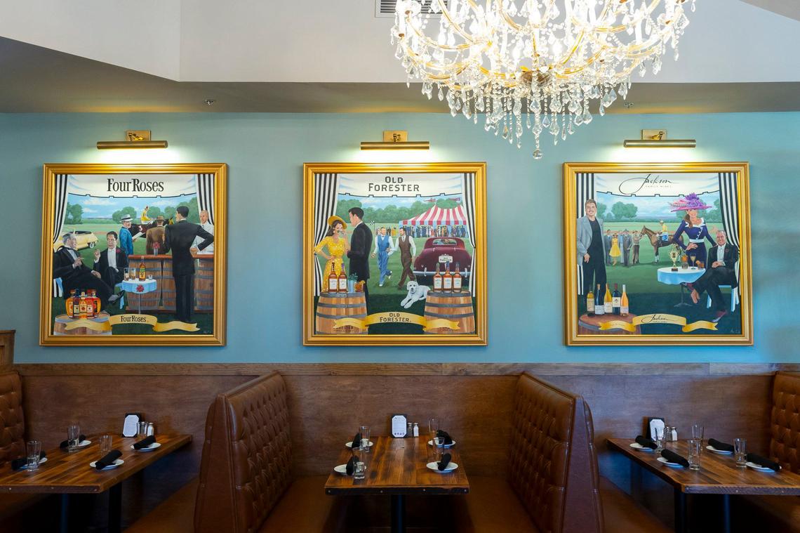 The dining room offers custom murals highlighting Kentucky bourbon distilleries and chandeliers at Carson’s new location at 3450 Todds Road in Lexington, Ky., on Friday, June 21, 2024.