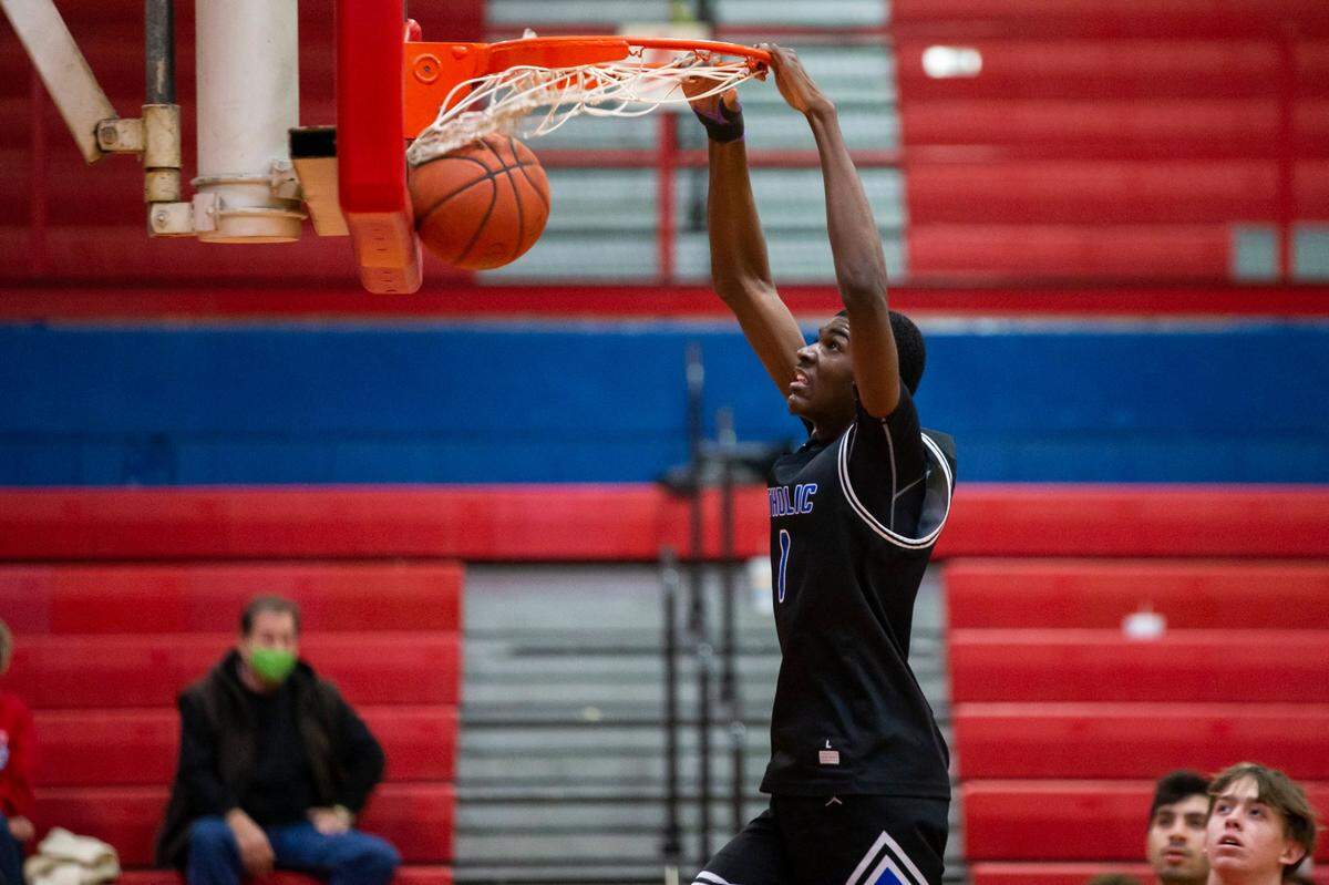 Lexington Catholic newcomer John McCrear just turned 16 years old. The 6-foot-8 sophomore is still growing, according to his great uncle, University of Kentucky football recruiting coordinator Vince Marrow.
