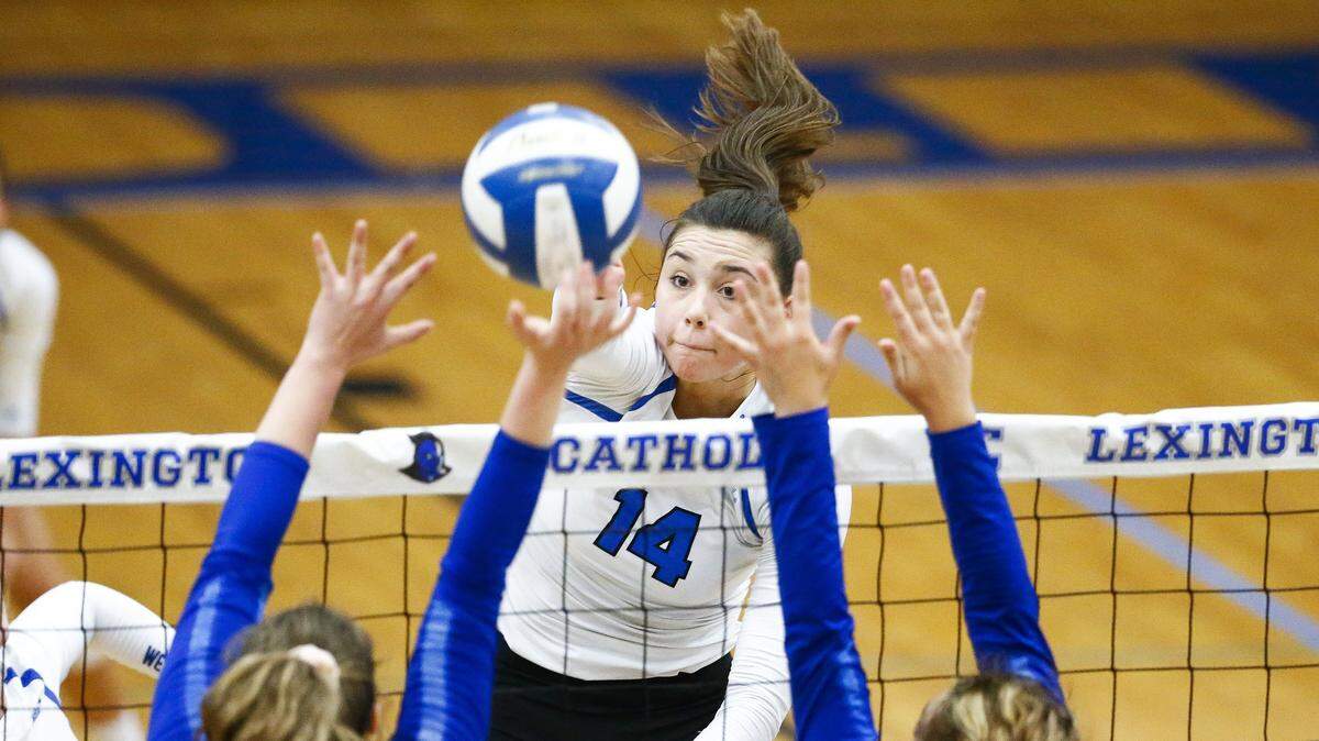 “I played basketball in sixth grade and I just wasn’t really into the physical contact part of it. It’s a little aggressive,” Lexington Catholic senior McKenna Vicini said with a laugh. “I like having the net separating us.”