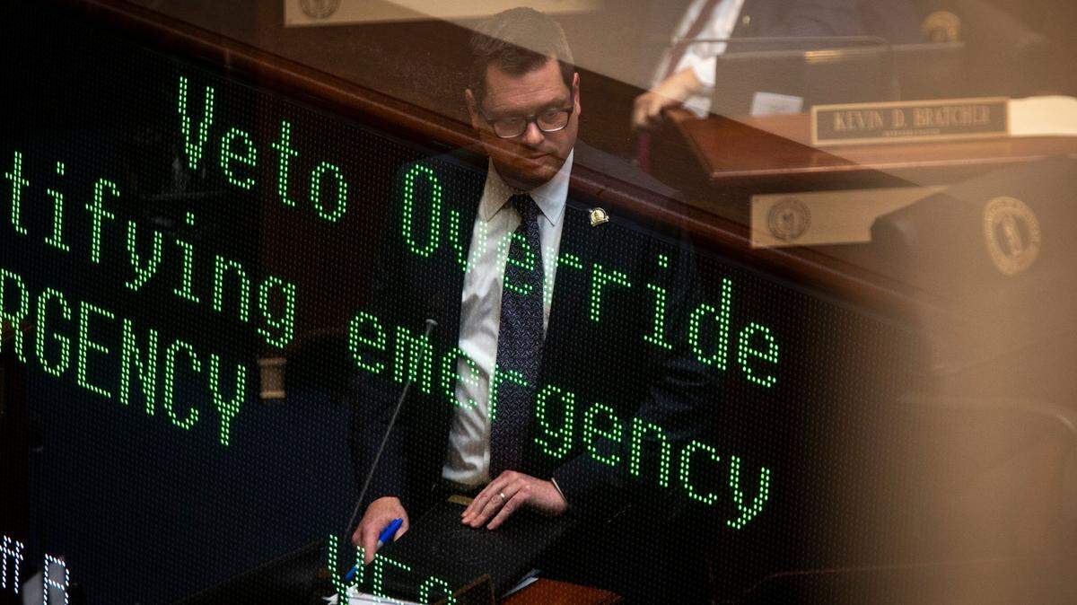 An in-camera double exposure of House Majority Floor Leader Steven Rudy on the floor with a screen displaying the vote information during the last two days of the legislative session at the Capitol in Frankfort, Ky., Monday, March 29, 2021.