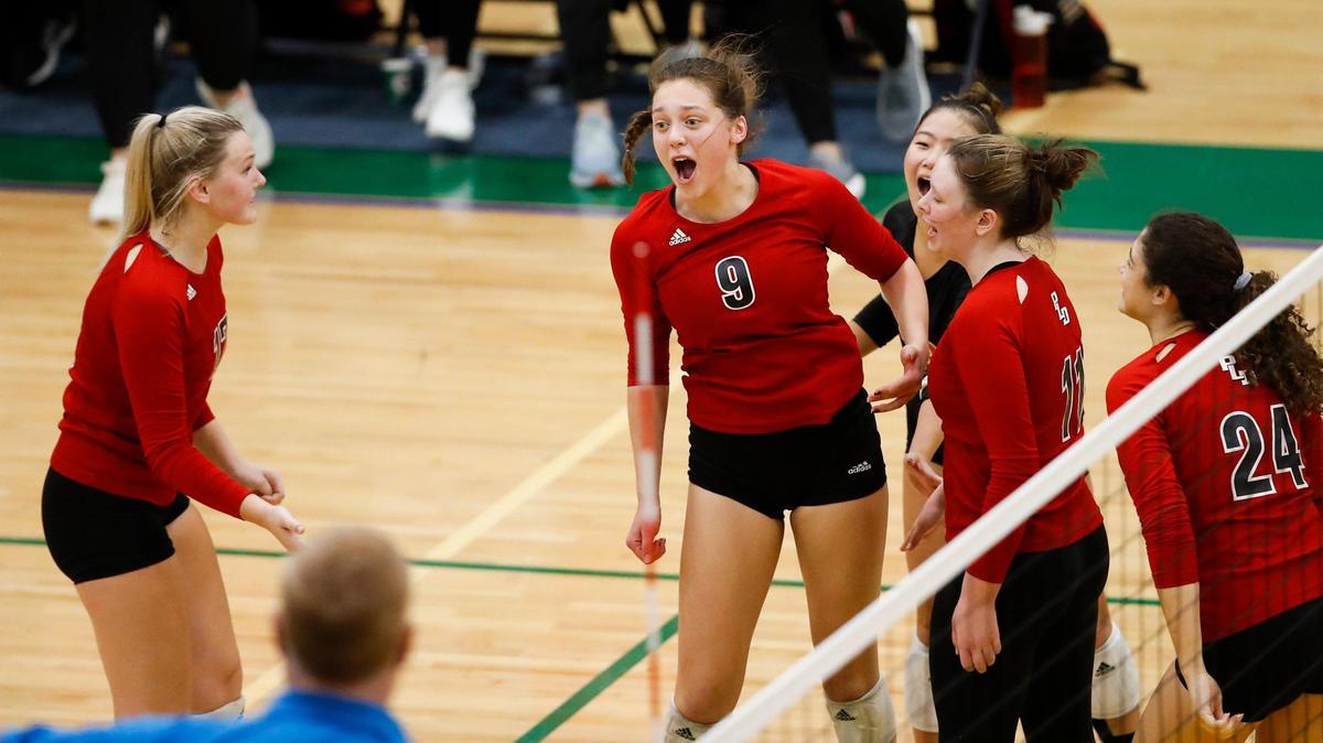 Paul Laurence Dunbar’s Ava Jackson (9) celebrates a kill against Great Crossing during the 11th Region Tournament. The Bulldogs have advanced to this week’s state quarterfinals.