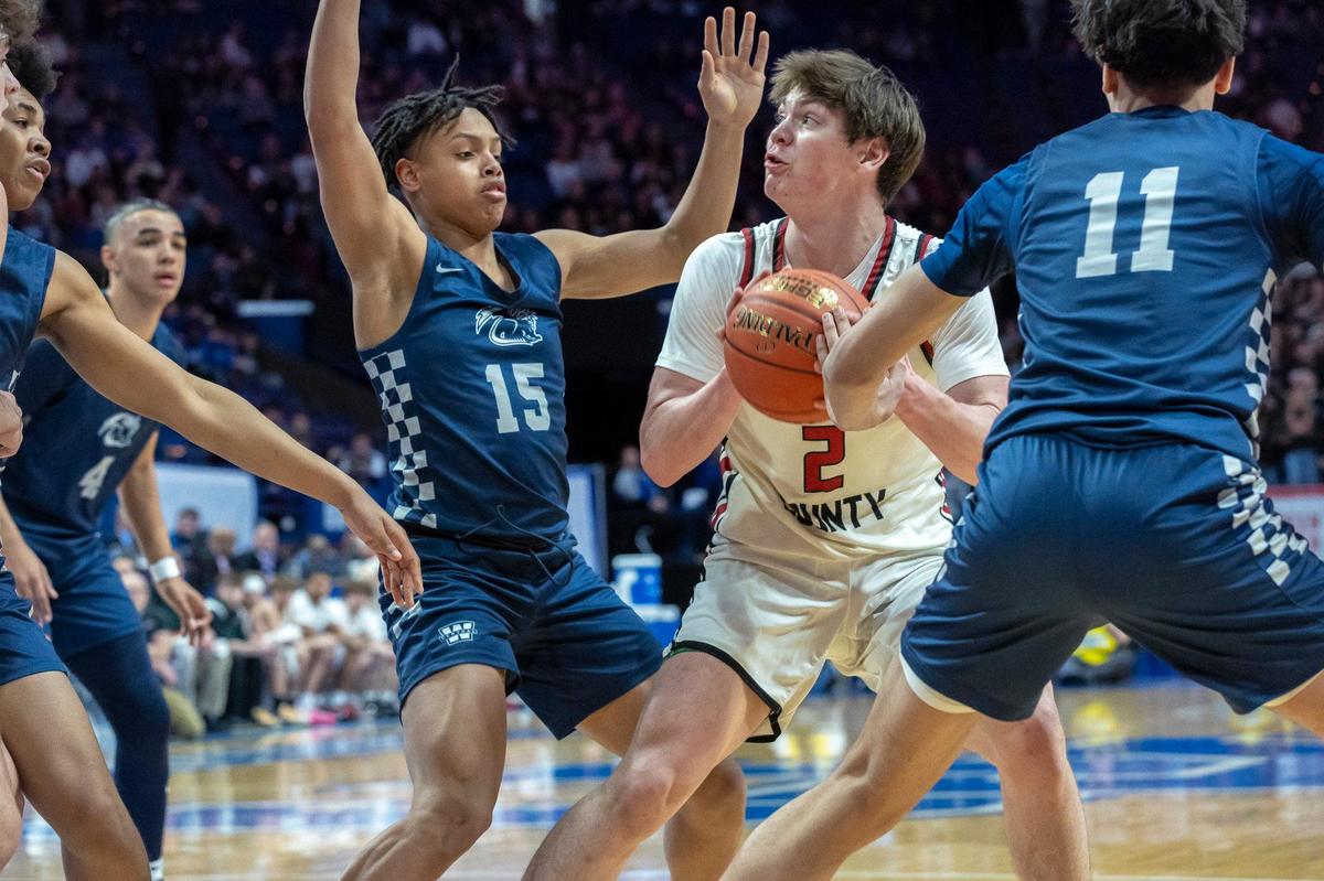 Harlan County’s Trent Noah (2) looks to shoot the ball as Warren Central’s Dominique Anthony (15) and Warren Central’s Jarek Kirk (11) converge on him during the UK HealthCare Boys’ Sweet 16 state basketball tournament at Rupp Arena on Thursday.