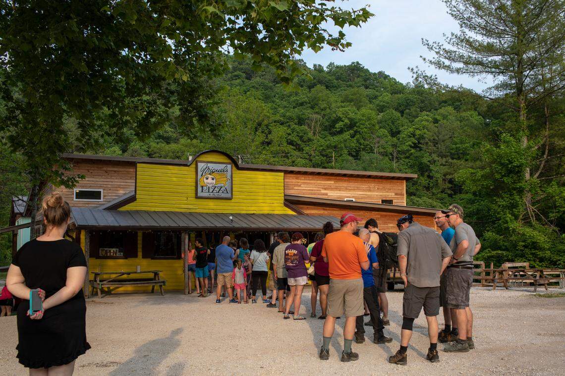 Patrons stand in line at Miguel’s Pizza in Red River Gorge on Monday, May 24, 2021.