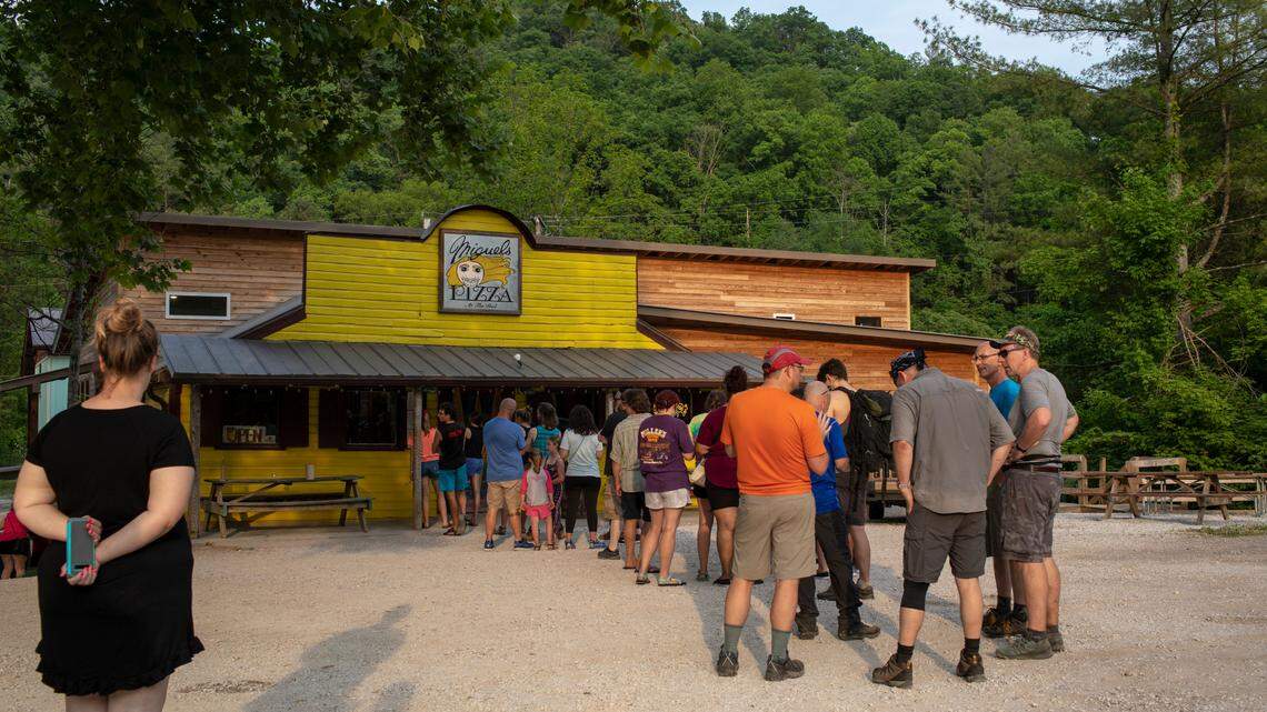 Patrons stand in line at Miguel’s Pizza in Red River Gorge on Monday, May 24, 2021.