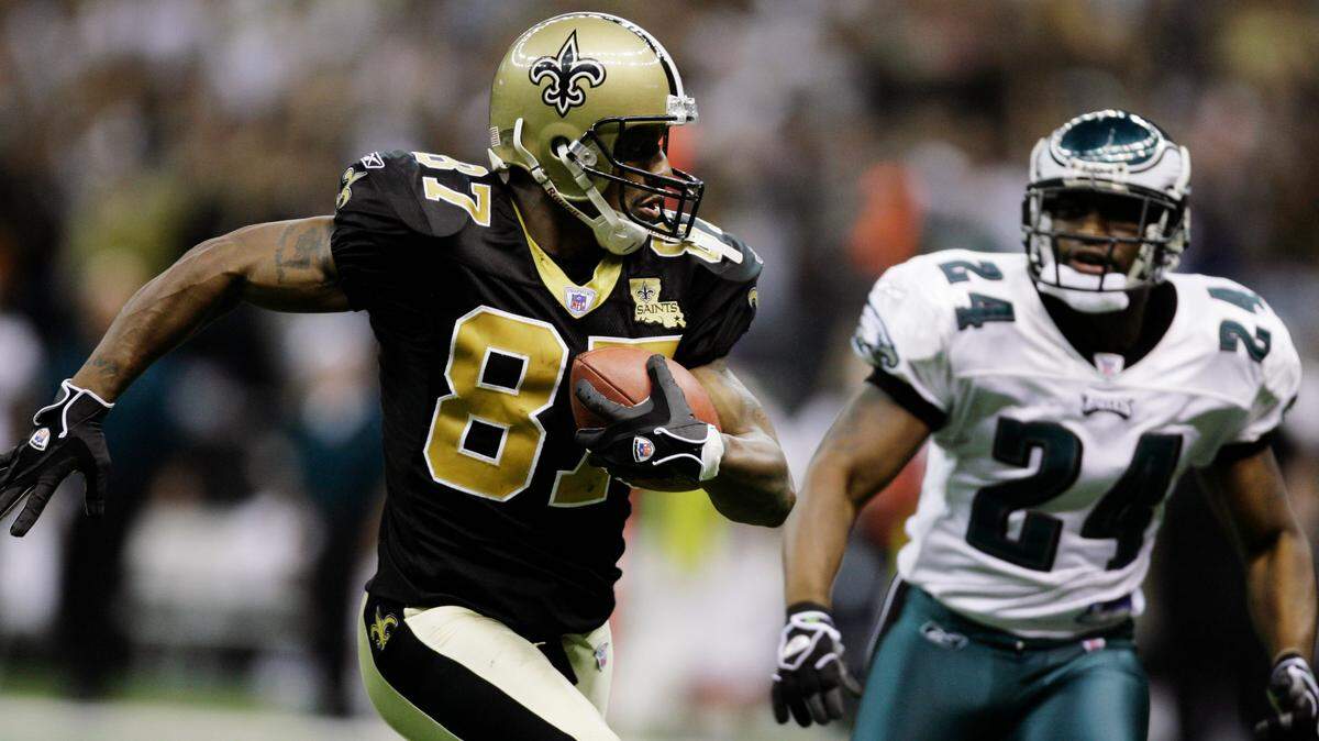 New Orleans Saints receiver Joe Horn (87) scores his second touchdown as he is chased by Philadelphia Eagles cornerback Sheldon Brown (24) in the second half of their NFL football game in New Orleans Sunday, Oct. 15, 2006. Saints won 27-24. (AP Photo/Alex Brandon)