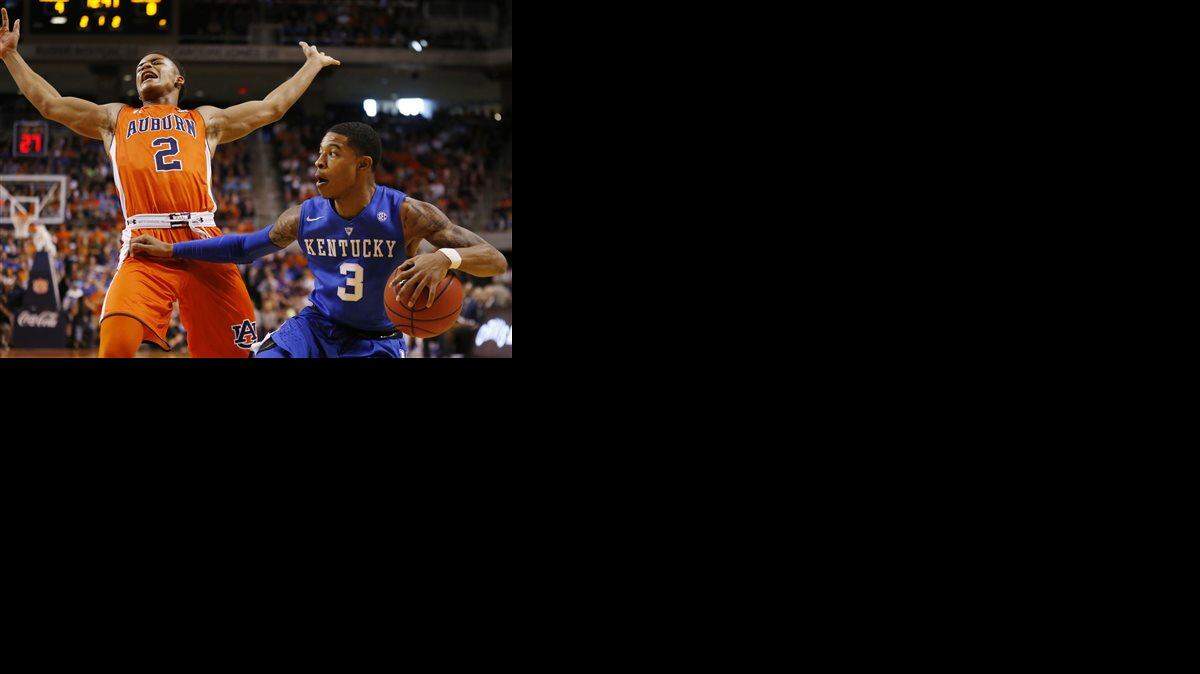 Kentucky guard Tyler Ulis (3) fouls Auburn guard Bryce Brown (2) during the first half of an NCAA college basketball game, Saturday, Jan. 16, 2016, in Auburn, Ala. (AP Photo/Brynn Anderson)