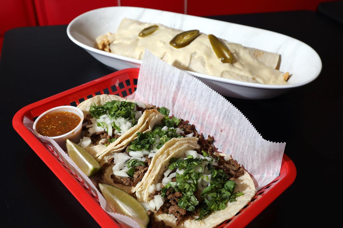 Steak tacos with cilantro, onion and tomatillo salsa and the XL Burrito at El Cid at 304 S. Limestone, the former home of Sav’s Grill.