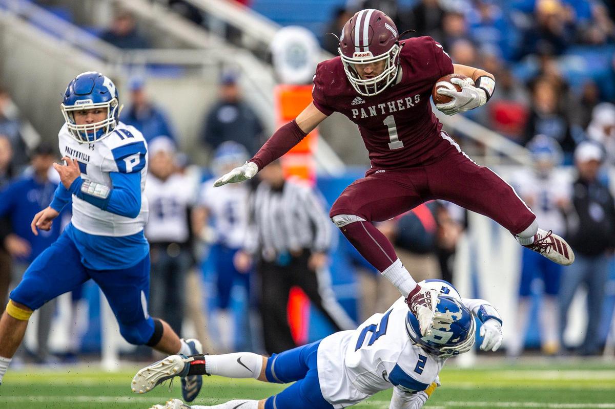 Pikeville’s Jackson Hensley (1) jumped over Paintsville’s Devin Hall (2) during Friday's game. Hensley caught touchdown passes of 63 and 15 yards as the Panthers won their fifth state championship.