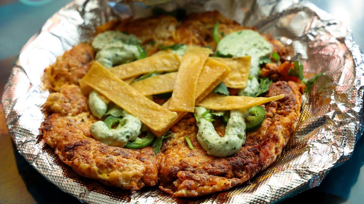 The DV Ocho ($9.75) from DV8 Kitchen is made with scrambled egg, chorizo, jalapeno, tortilla strips, potatoes, cilantro cream and served with warm corn tortillas and hot sauce.