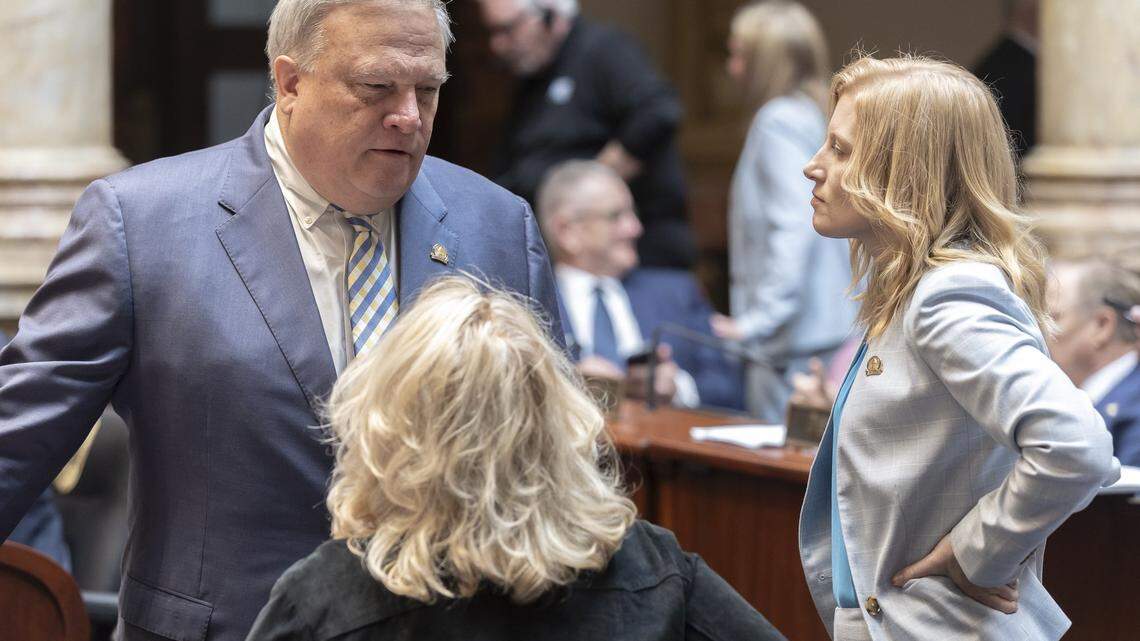Kentucky Senate President Robert Stivers, R-Manchester, speaks with Sen. Robin Webb, D-Grayson, center and Sen. Cassie Chambers Armstrong, D-Louisville, right, in the Senate chambers at the Kentucky state Capitol in Frankfort, Ky., Monday, April 15, 2024.