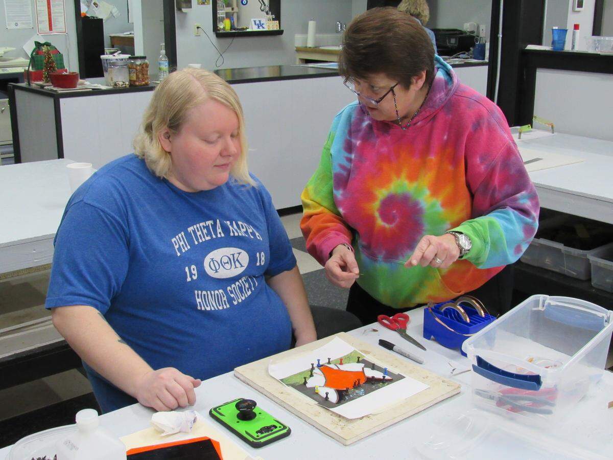 Julie Pitts, right, helped student Heather Smith with her creation of a fox on Dec. 12, 2019, at Willing Hearts in Harlan County.