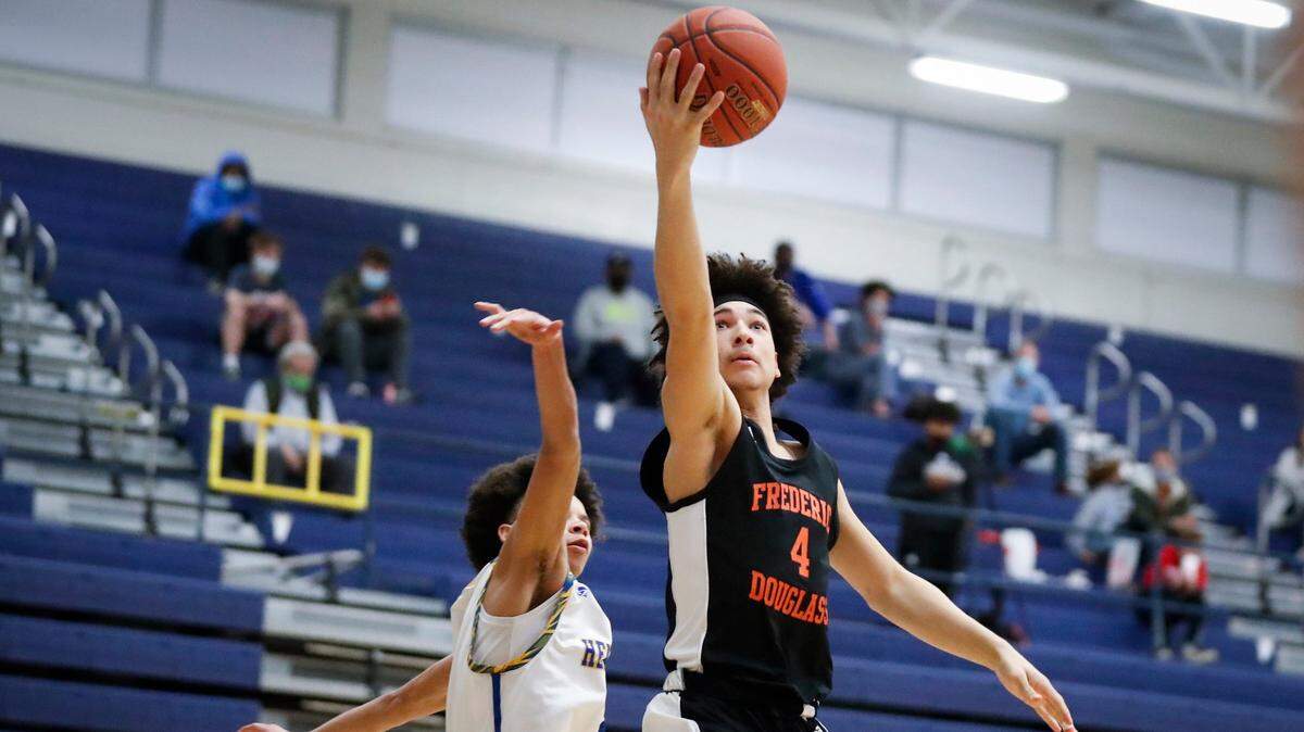Frederick Douglass’ Kai Simpson (4) shoots over Henry Clay’s Sincere Madison (4) during their game at Henry Clay High School in Lexington, Ky., Tuesday, March 9, 2021. Frederick Douglass defeated Henry Clay 78-70.