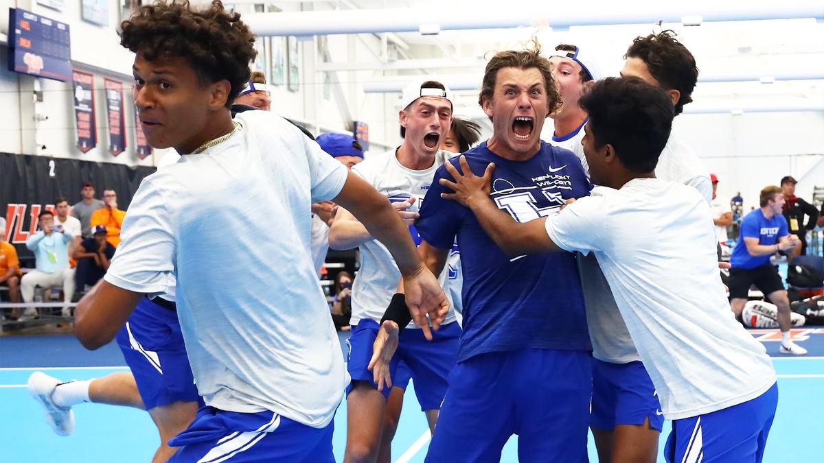 The Kentucky men’s tennis team celebrates its NCAA Men’s Tennis Tournament semifinal win over Ohio State on Saturday afternoon inside the Atkins Tennis Center in Champaign, Illinois. Kentucky will play in the NCAA championship match on Sunday.