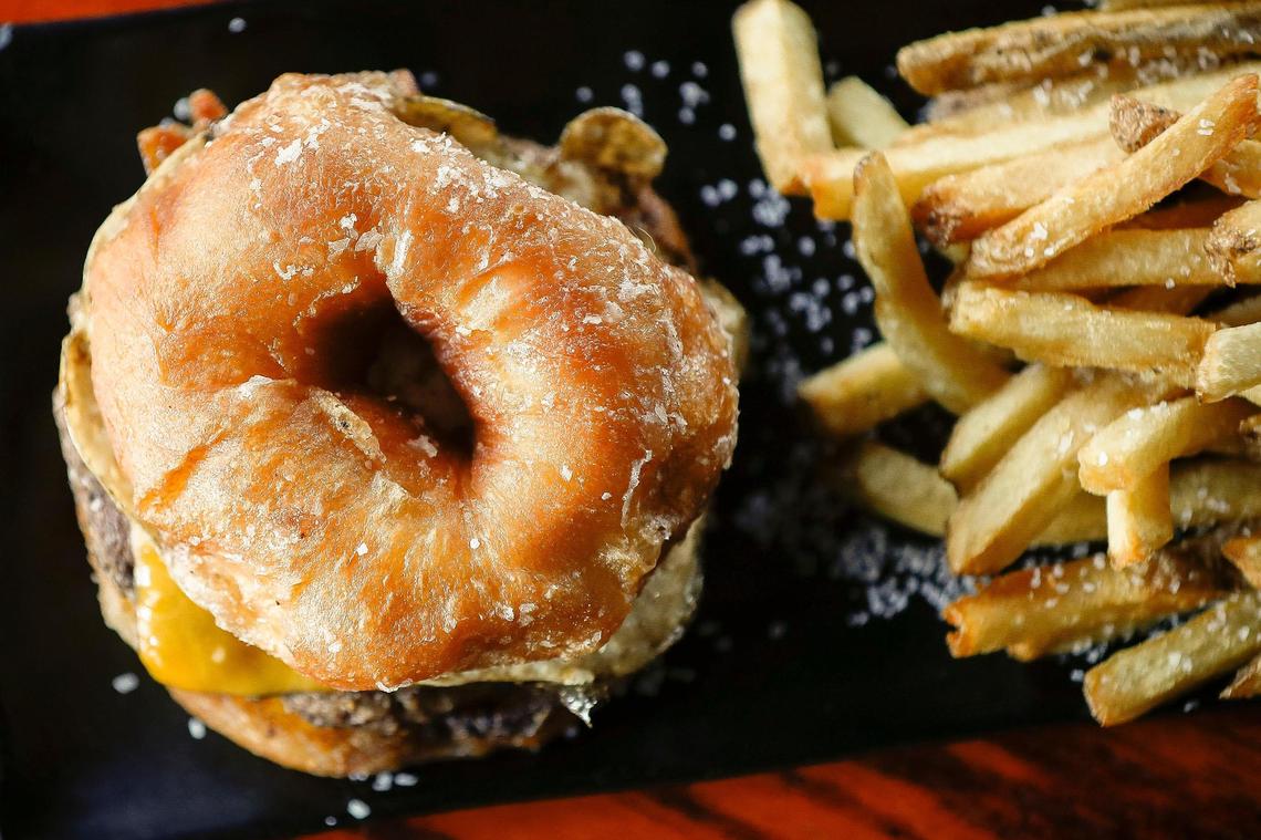 Bad Wolf’s Spalding Burger made with a six-ounce season beef patty, aged cheddar cheese, smoked bacon, a fried egg and topped with a Spalding glazed doughnut for the bun.