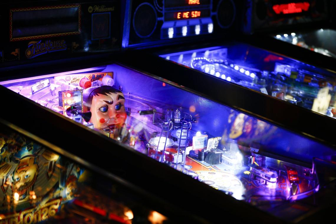 A row of pinball machines Thursday at the Burl Arcade in Lexington. The Burl Arcade offers a variety of retro games including Pac-Man, Galaga, skee ball and pinball.