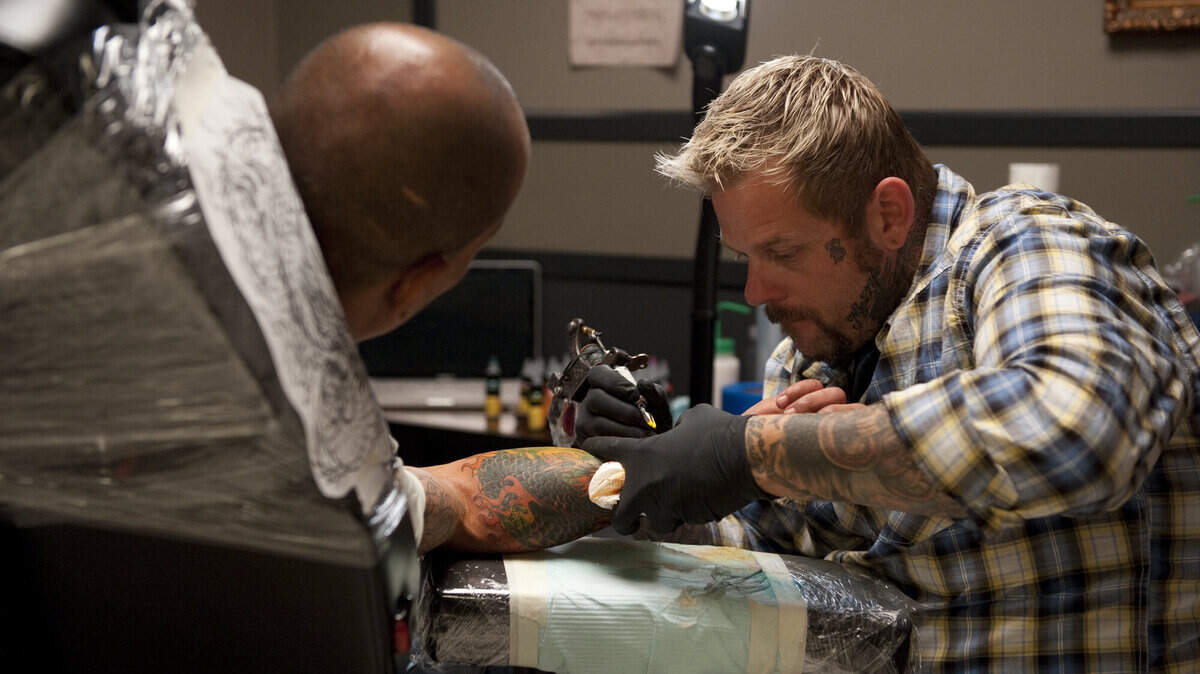 Tray Benham, right, a tattoo artist in Brandenburg, is a  contestant on the upcoming season of the reality show Ink Master. 