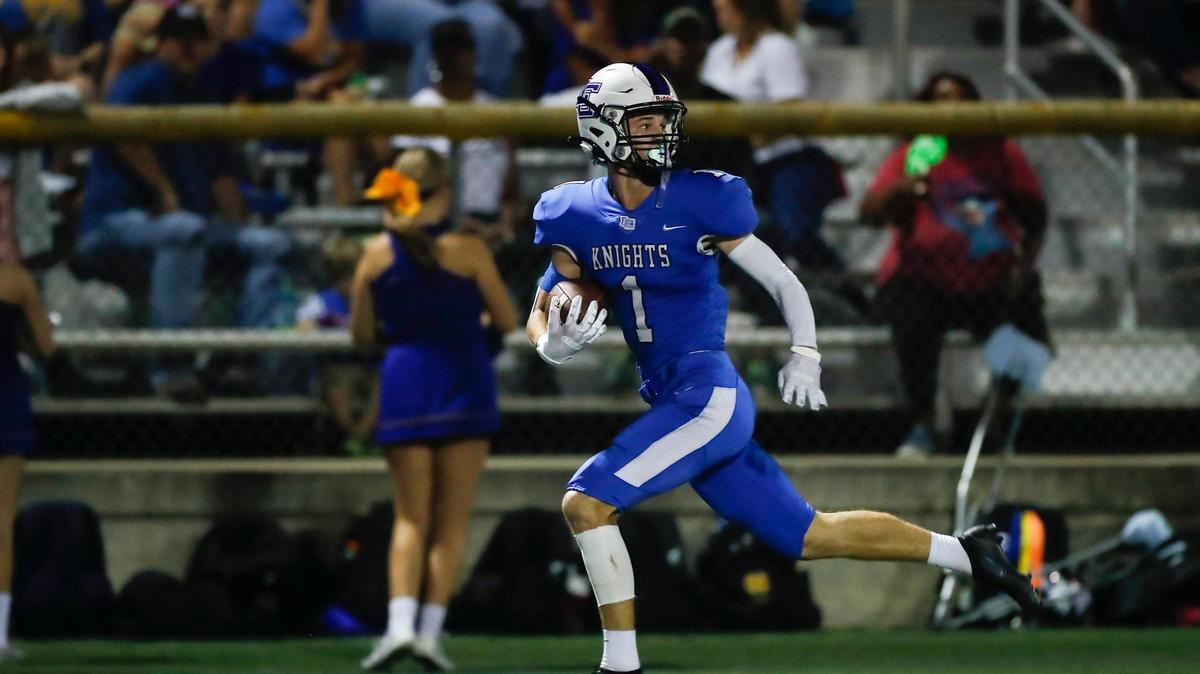Lexington Catholic’s Max DeGraff runs with the ball after catching a pass against Henry Clay during a game on Aug. 26.
