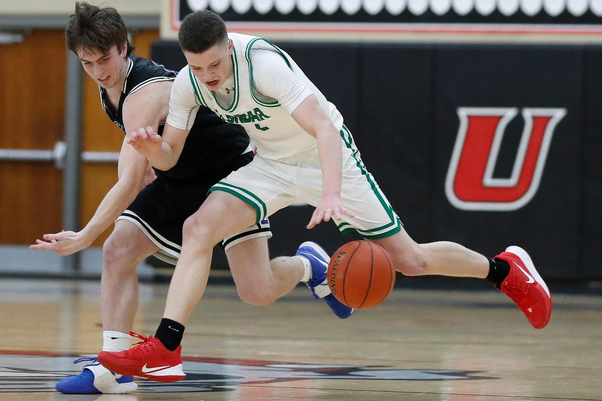 Paul Laurence Dunbar’s Nick Spalding (2) scored 13 of his 25 points in the fourth quarter to lead the Bulldogs to the win on Friday night.
