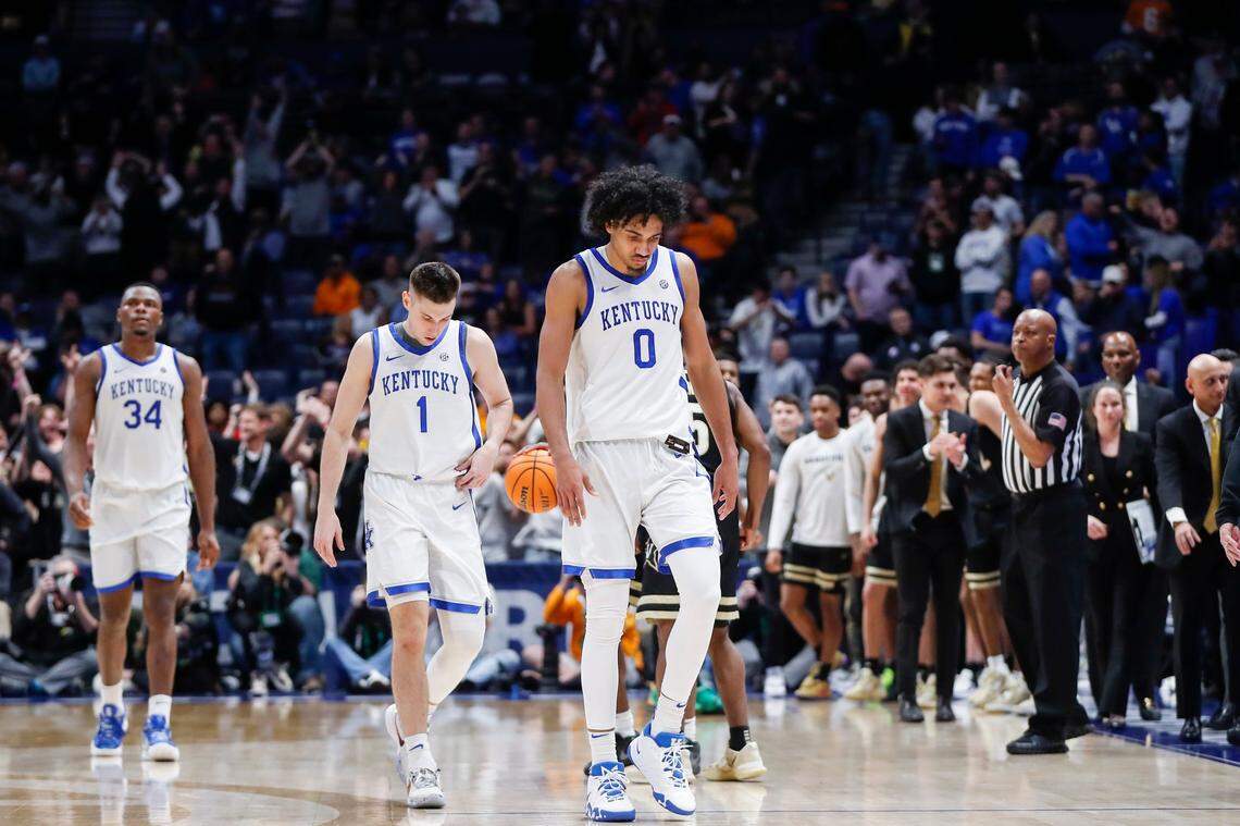 Kentucky’s Oscar Tshiebwe (34), CJ Fredrick (1) and Jacob Toppin (0) walk off the court after their team’s loss to Vanderbilt in the SEC Tournament quarterfinals.
