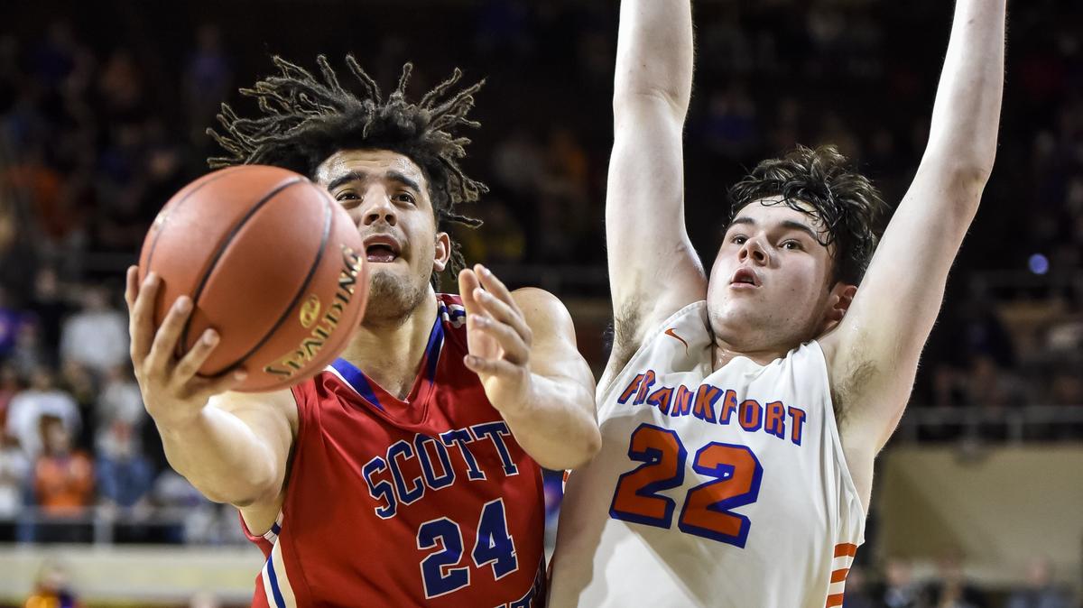 Scott County’s Michael Moreno (24) shoots around Frankfort’s Jackson Twombly (22), during the semifinals of the 11th Region, Wednesday, February 27, 2019, at EKU’s McBrayer Arena in Richmond.
