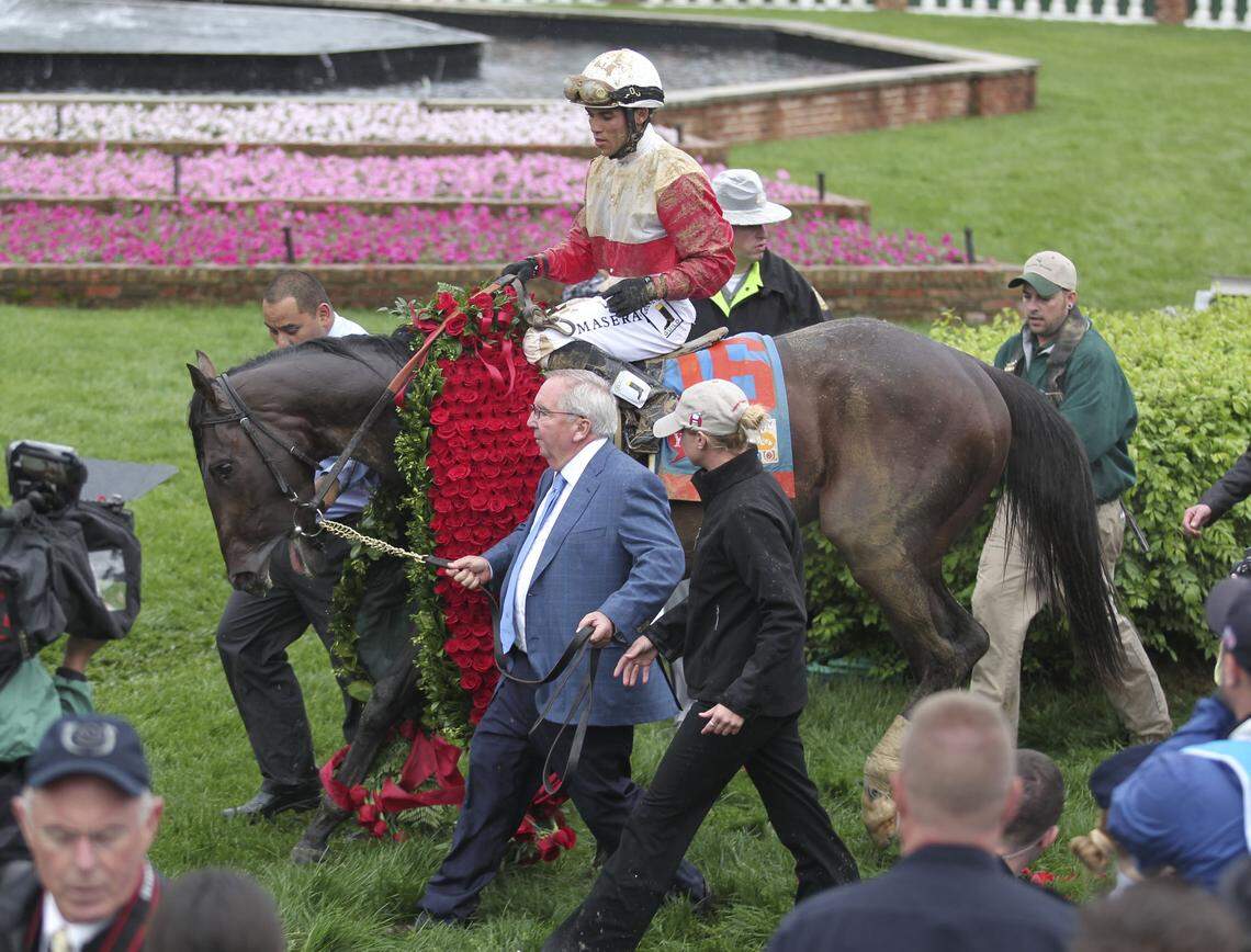 Winning trainer Shug McGaughey led Orb with Joel Rosario up to the  winner's circle after the 139th running of the Kentucky Derby at  Churchill Downs on May 4, 2013.