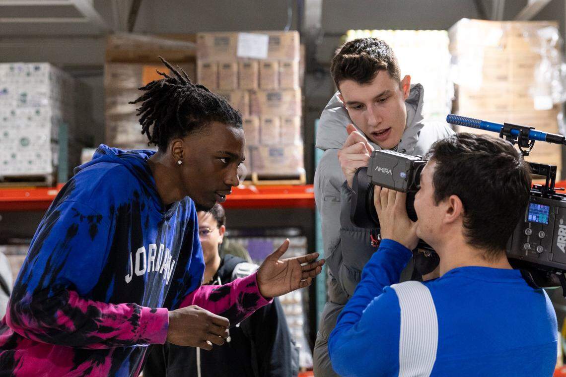 Aaron Bradshaw, left, and Kentucky basketball teammate Zvonimir Ivisic mess around with a staff videographer during a charity event the day before UK played Penn in Philadelphia.