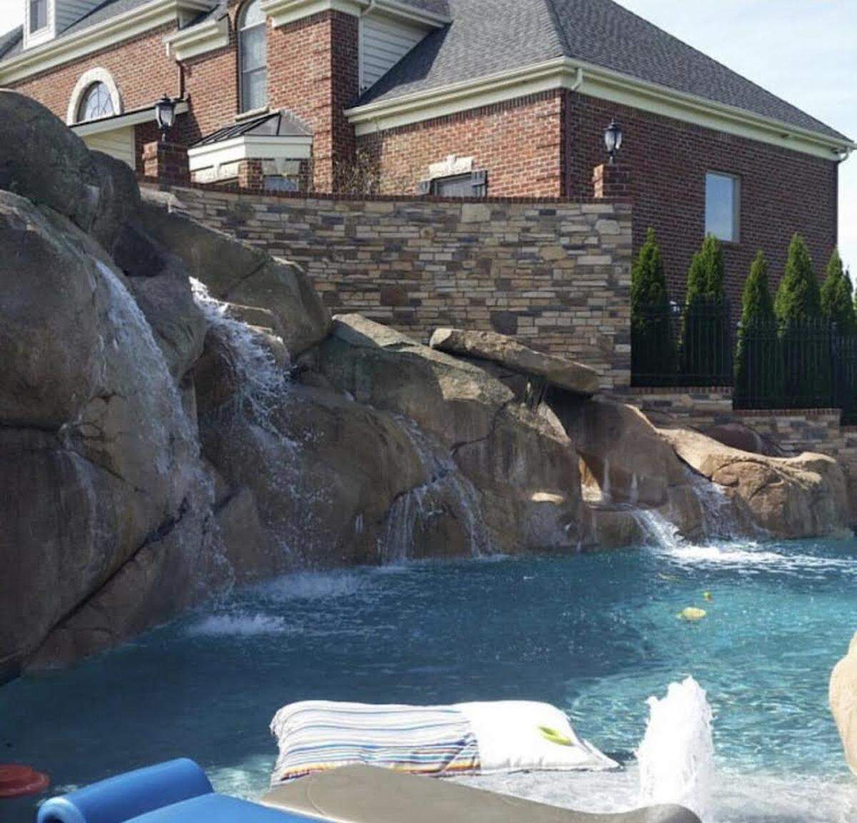 The pool at this luxury Lexington home includes a 40-foot rock water slide.