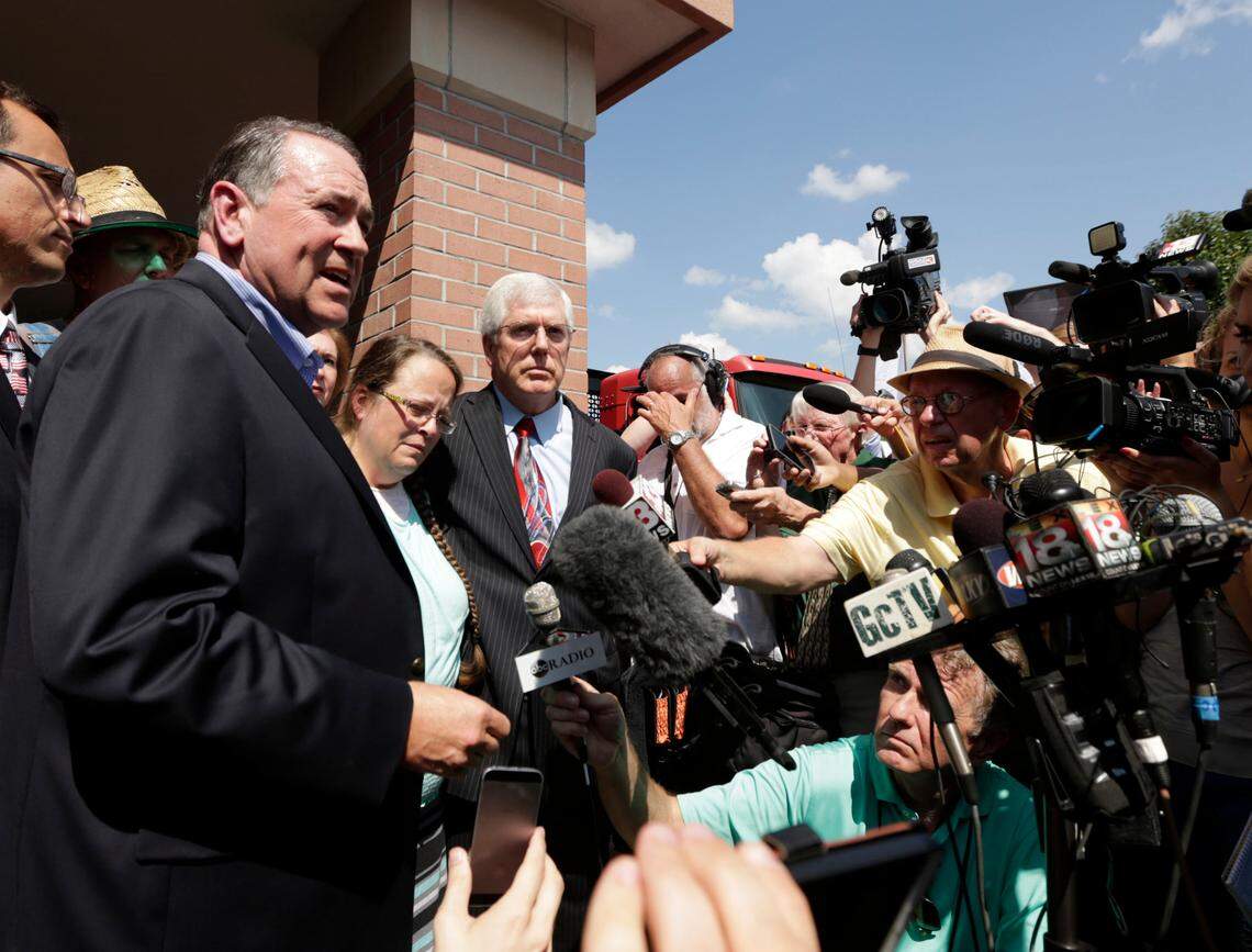 Rowan County Clerk Kim Davis was flanked by Republican presidential candidate Mike Huckabee, left, and her attorney Mat Staver on Tuesday after she was released from the Carter County jail.