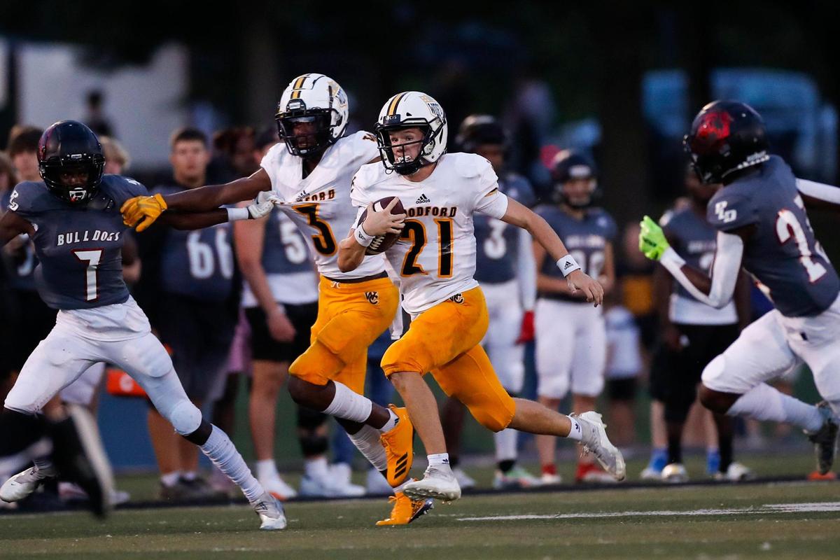 Woodford County quarterback Andrew Nason (21) passed for 122 yards and rushed for 183 on Friday night. He ran for one touchdown and threw for another.