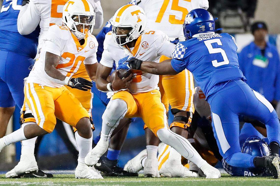 Kentucky linebacker DeAndre Square (5 in blue) sacked Tennessee quarterback Hendon Hooker (5 in white) during UT’s 45-42 victory over UK last season at Kroger Field.
