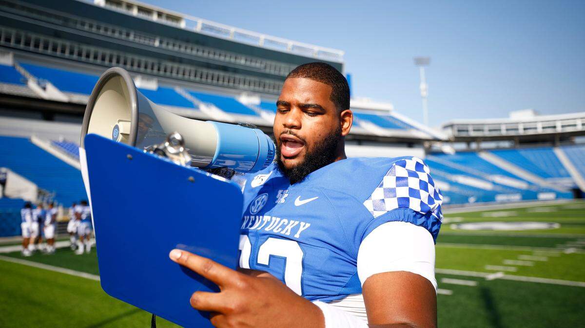 Kentucky Wildcats defensive lineman Phil Hoskins (92) uses a megaphone to callout players during the University of Kentucky Football Media Day at Kroger Stadium in Lexington, Kentucky on Friday, August 2, 2019. (Silas Walker for the Herald-Leader)